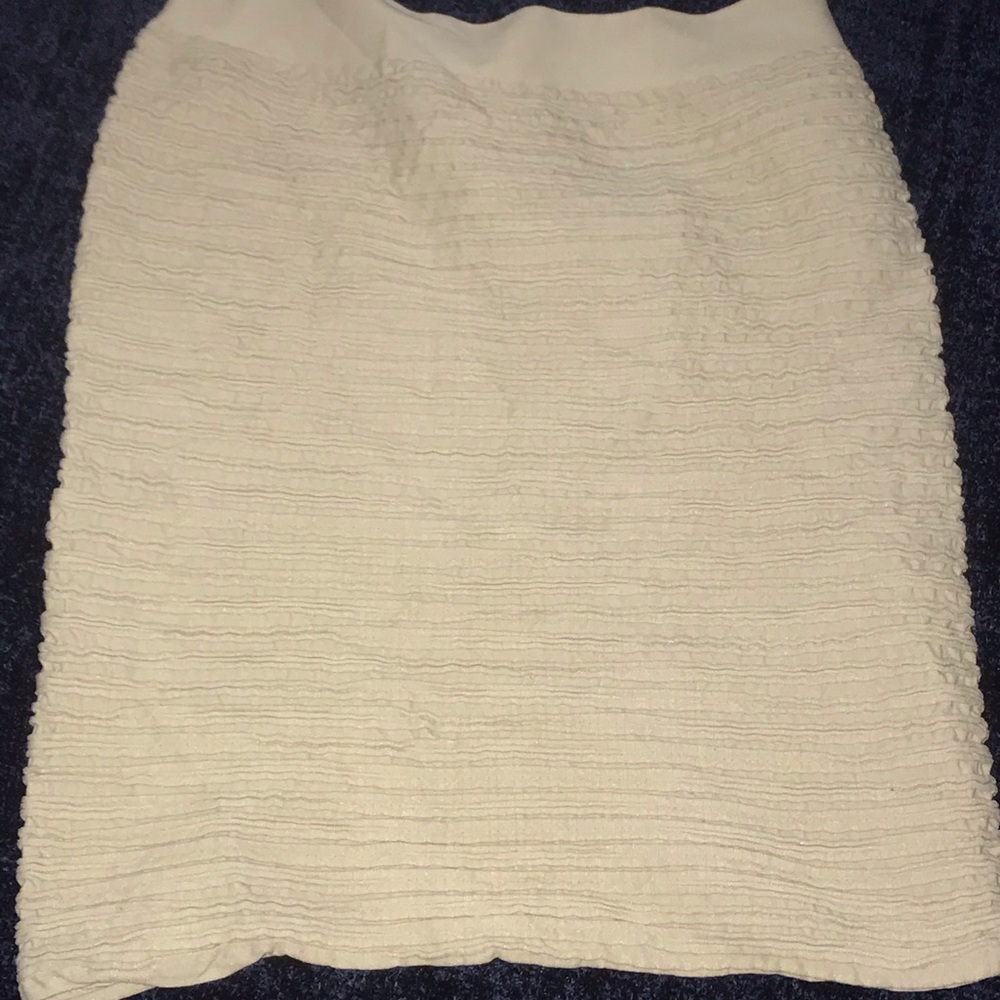 Stretchy tan mini skirt.